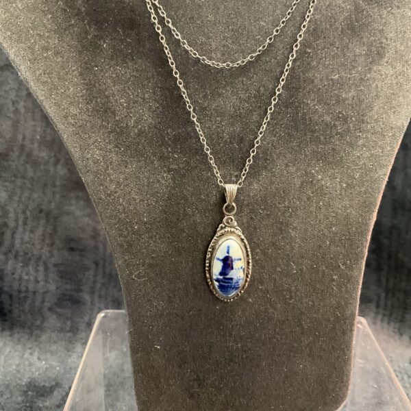 Vintage sterling silver pendant with delicate Delph scene on necklace.