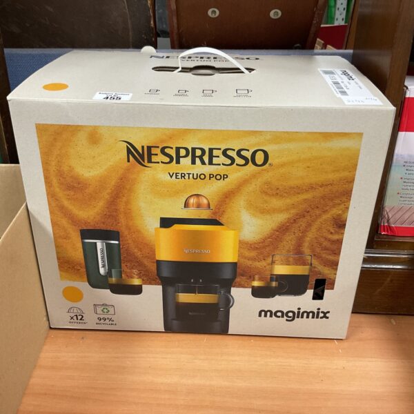 Front view of boxed Nespresso Vertuo Pop coffee machine.