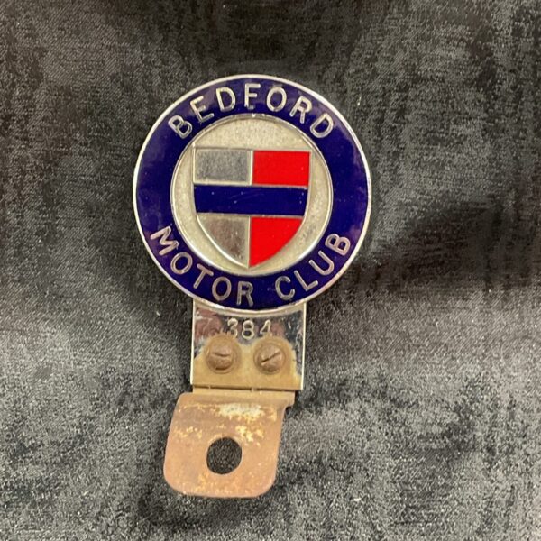 Vintage Bedford Motor Club car badge with red, white, and blue shield.