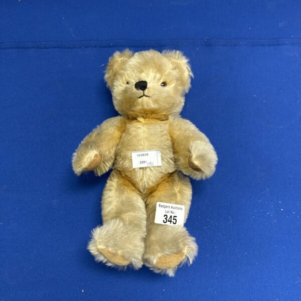 Vintage Chad Valley teddy bear with glass eyes and golden mohair.