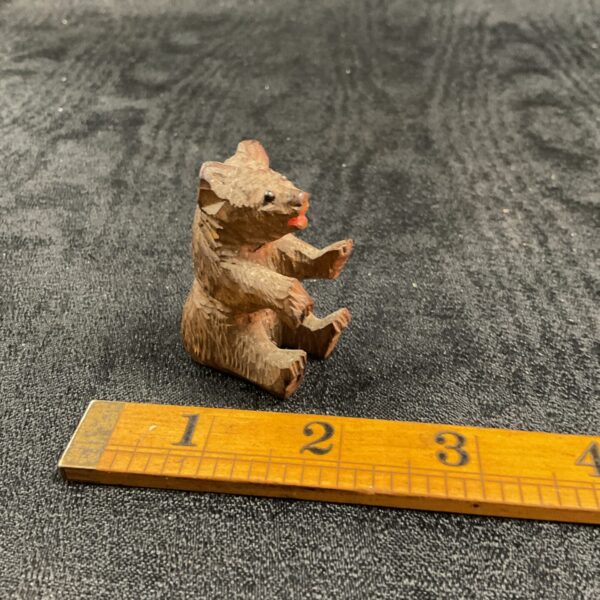 Antique Black Forest carved wooden bear figurine, detailed carving.
