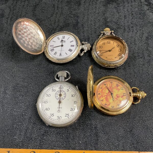 Vintage quartz pocket watches and stopwatch lot for collectors.