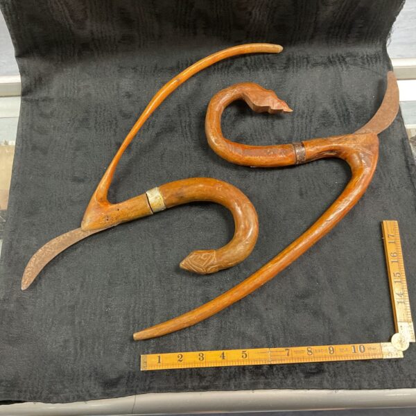 Antique Khmer rice cutting tool with naga dragon head handle.