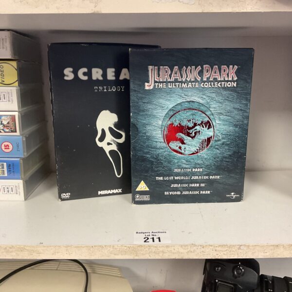 DVD box sets of Scream and Jurassic Park for film collectors.