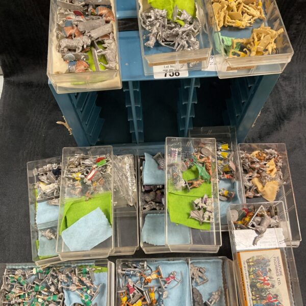 Vintage lead soldier collection in a multi-drawer storage box.