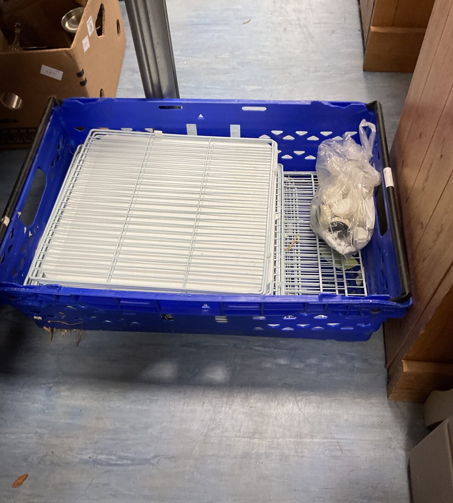 Crate containing cat cage with fittings