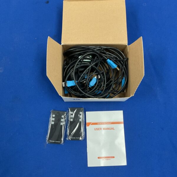 Black HDMI KVM switch with included cables in original packaging.