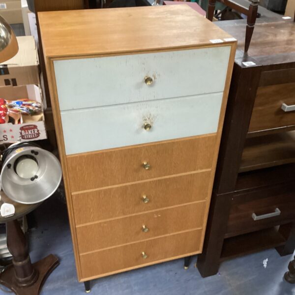 Vintage 1960s tallboy drawers offering stylish bedroom storage.