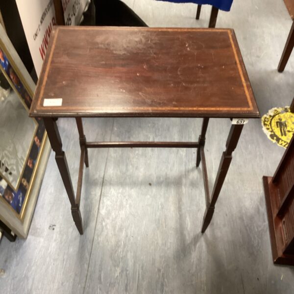 Vintage mahogany occasional table with curved legs.