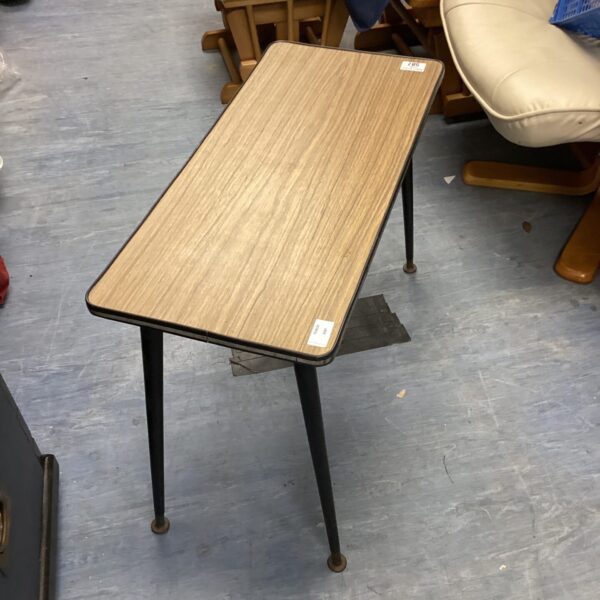 Vintage 1960s coffee table with a formica top.
