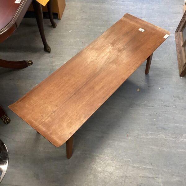 Vintage 1970s mahogany coffee table with a warm wood tone.