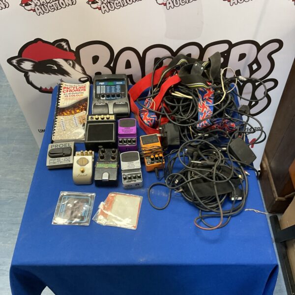 Box of guitar pedals cables and straps incl. Behringer, Guv’nor plus, Boss