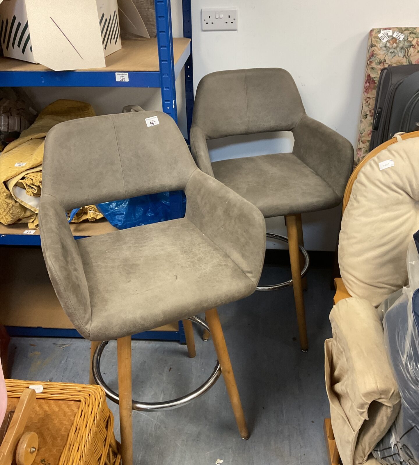 Pair of grey fabric swivel bar stools