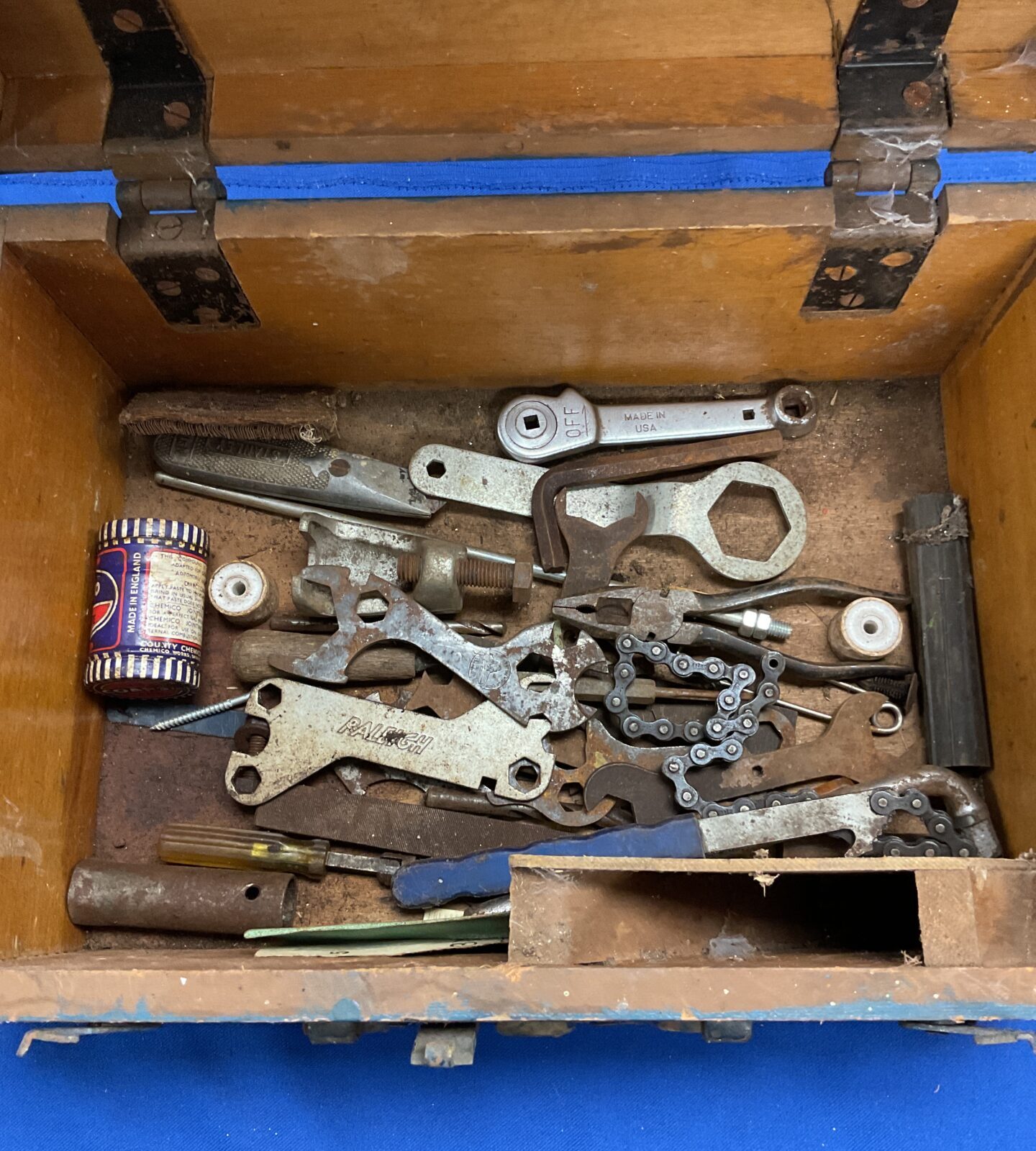Wooden tool chest with assorted tools