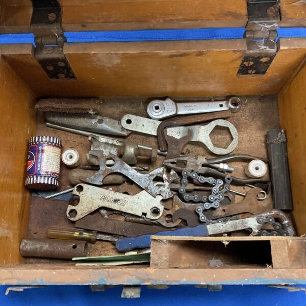 Wooden tool chest with assorted tools