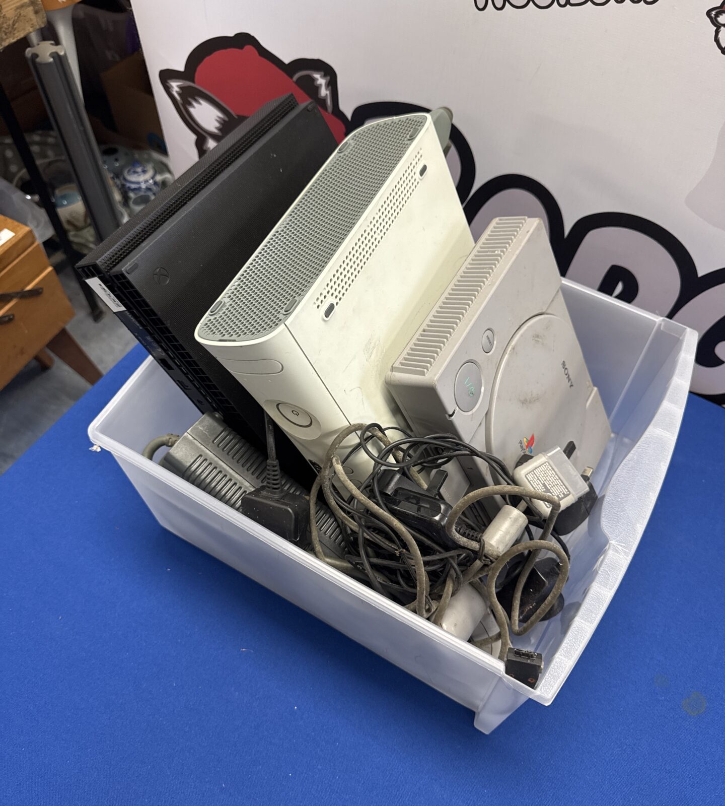 Xbox one X, Xbox 360 & Sony PlayStation consoles with some cables & a controller - untested