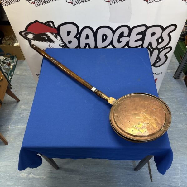 Antique copper bed warming pan with flower patern