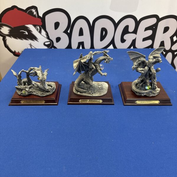 Three heavy pewter might & magic dragon figures