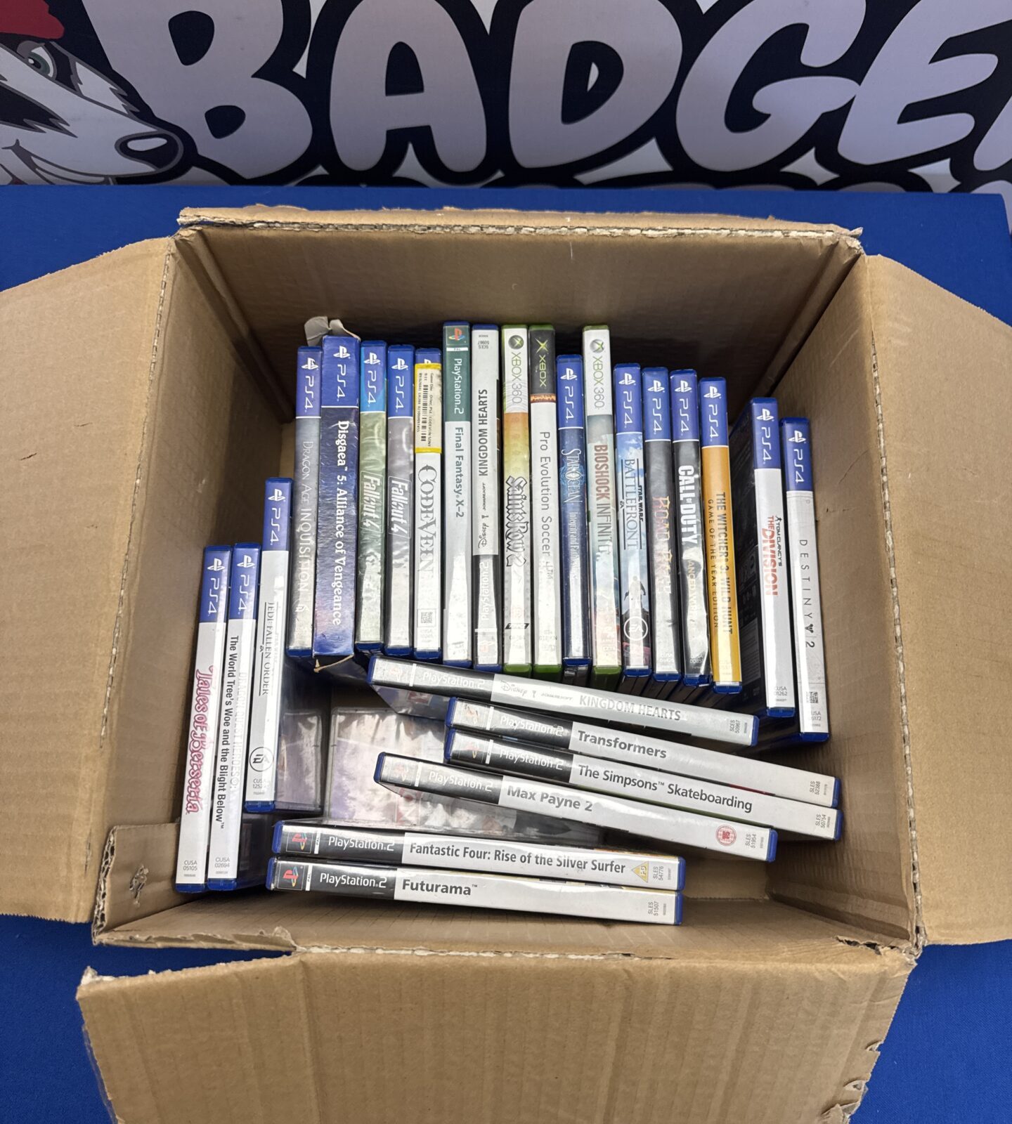 Box of PlayStation & xbox games