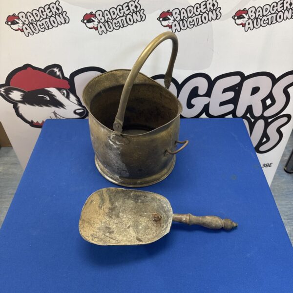 Vintage brass coal scuttle with shovel for fireplace use.