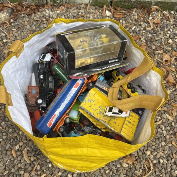 Large lot of diverse diecast and toy cars for collectors.