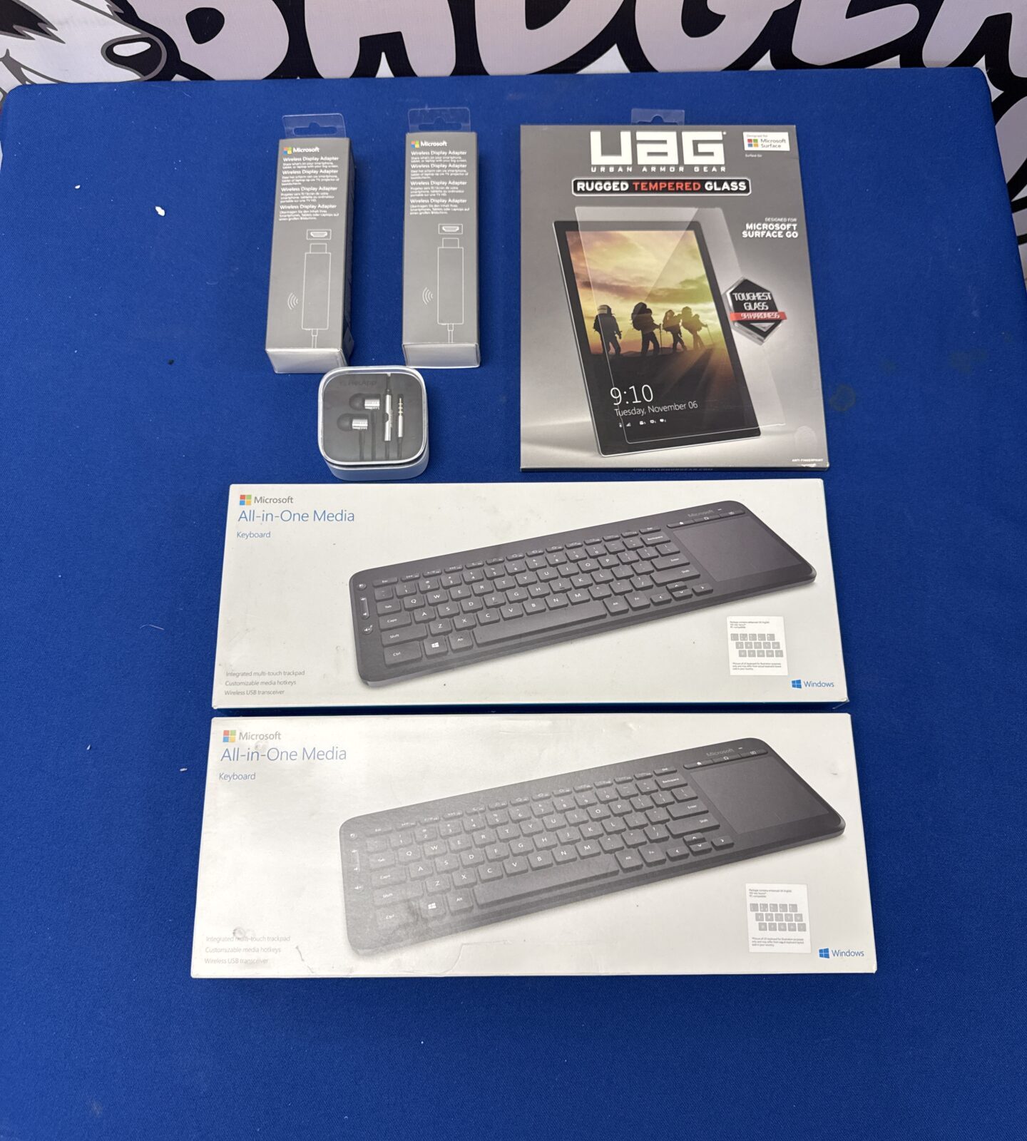 Bundle of items inc two Microsoft keyboards, wireless display adapters, earbuds & tablet protective cover