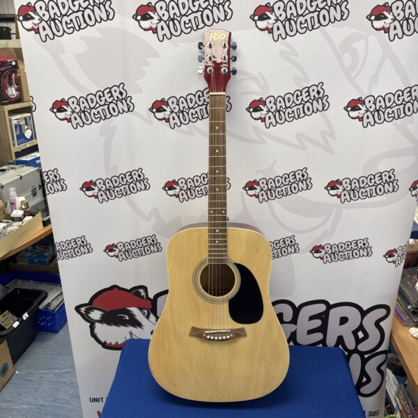 Natural finish Rio acoustic guitar, ideal for beginners.
