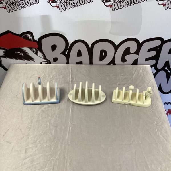 Vintage lot of three toast racks, including Lurpak and Kensington brands.
