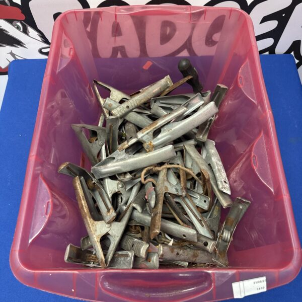 Lot of metal market canopy clips for securing outdoor canopies.