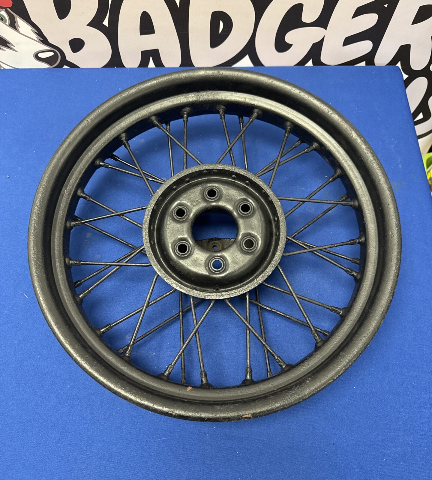 Vintage morris 8 wire wheel converted to a wall hanger