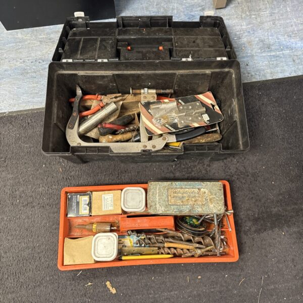 Keter plastic toolbox filled with assorted hand tools.