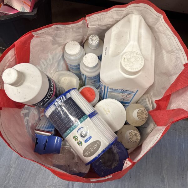 Lay Z Spa chemicals and filters in a plastic bag.