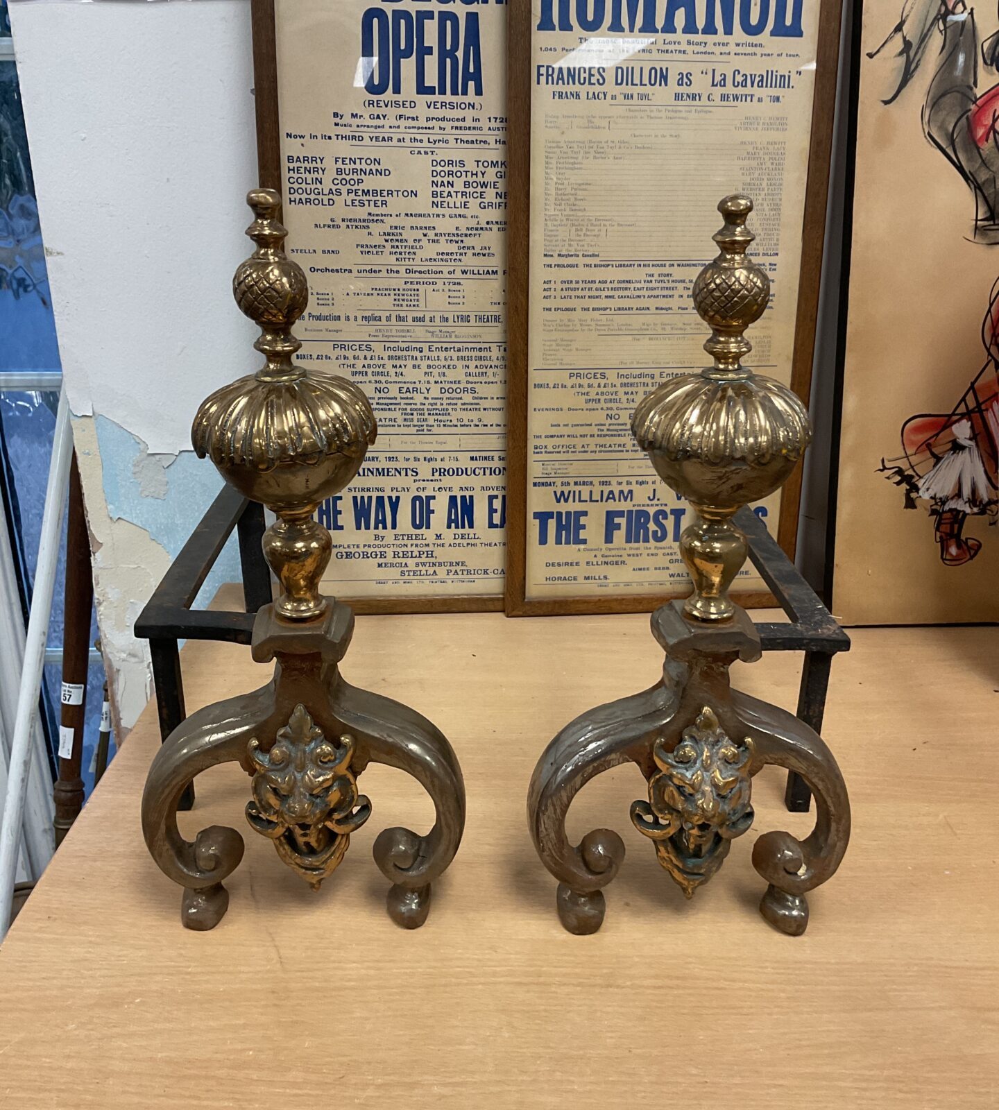 Antique pair of brass & wrought iron fire dogs with dragon head on front