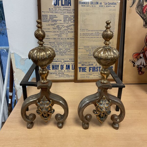 Antique pair of brass & wrought iron fire dogs with dragon head on front