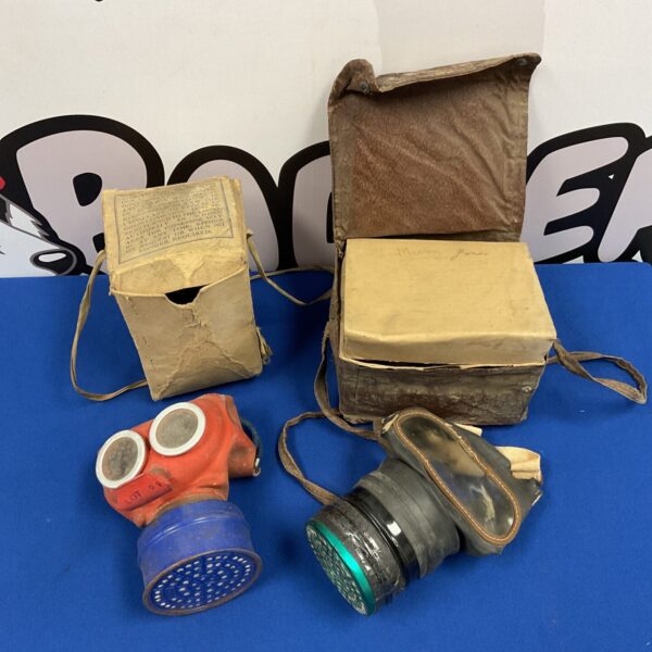 Vintage WW2 gas masks in original boxes, a rare collectible.
