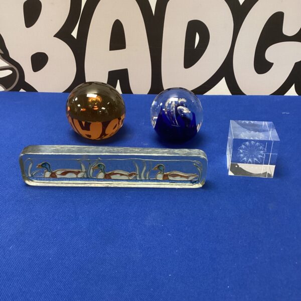 Vibrant Murano glass paperweights with handmade glass ducks.