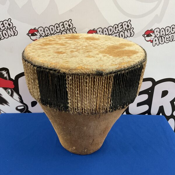 Large South Pacific bongo drum, traditional wooden percussion instrument.