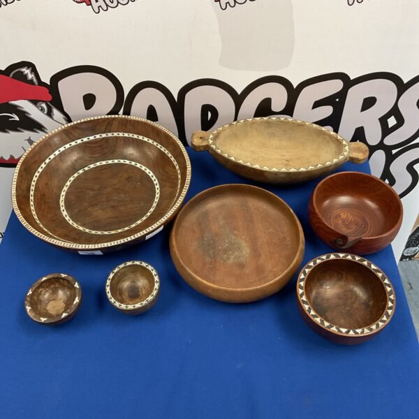 Hand-carved South Pacific wooden bowl with mother of pearl inlay.