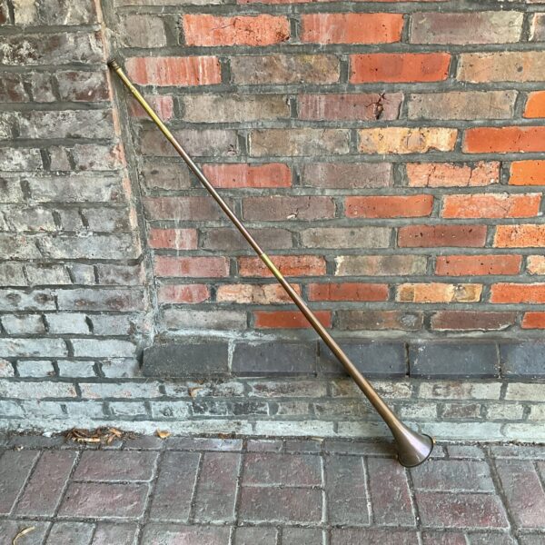 Antique copper coaching horn, vintage brass signalling instrument.