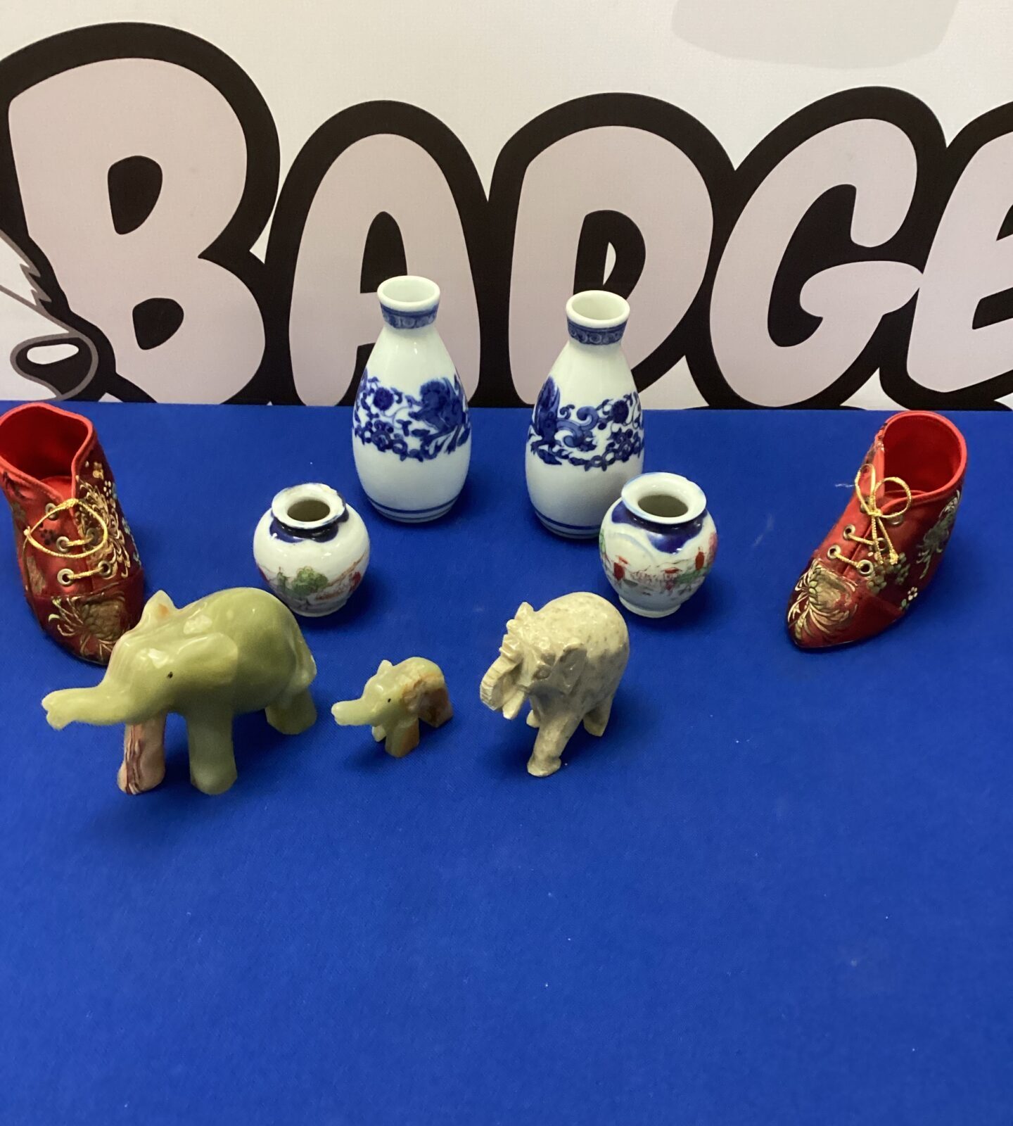 Four vintage porcelain miniature vases with onyx elephants