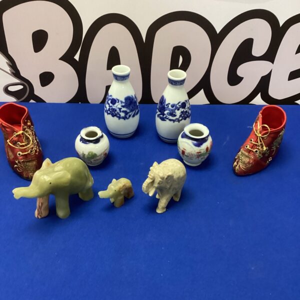 Four vintage porcelain miniature vases with onyx elephants