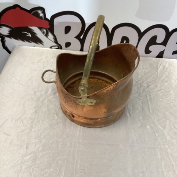 Vintage copper coal bucket with handle, antique fireplace accessory.