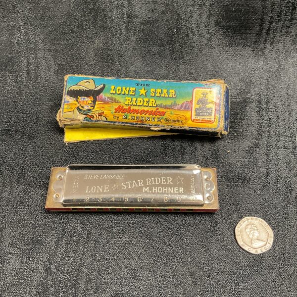 Vintage Hohner Lone Star harmonica, collectible musical instrument.