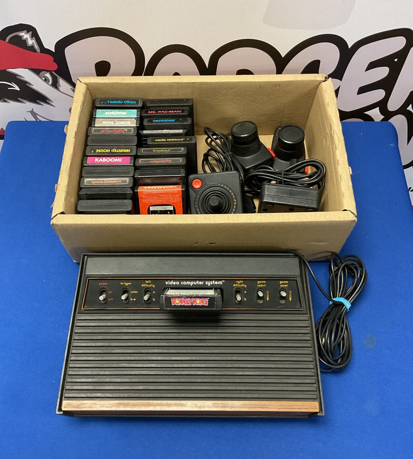 Atari 2600 woody console with controllers & games - working