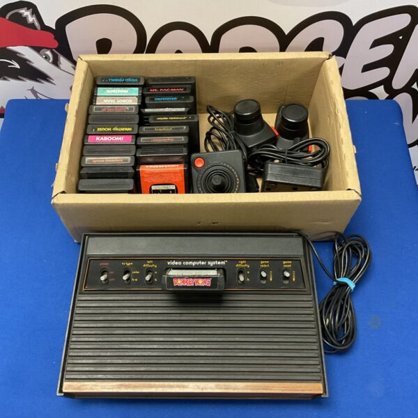 Atari 2600 woody console with controllers & games - working