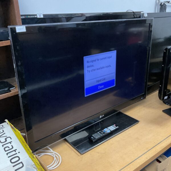 Front view of LG 42" 3D television with remote.