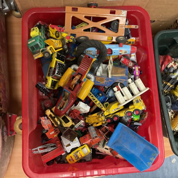 Vintage diecast Matchbox and Corgi car collection in a plastic container.