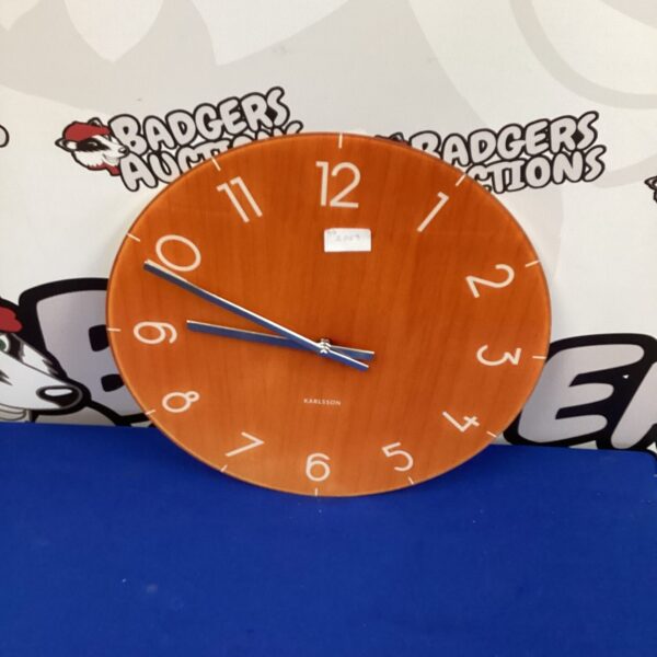 Karlsson glass wall clock with a minimalist design.