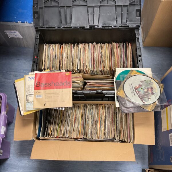 Large lot of vintage 7 inch vinyl records for collectors.