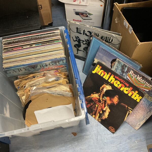 Vintage vinyl record collection including Jimi Hendrix and Eagles albums.